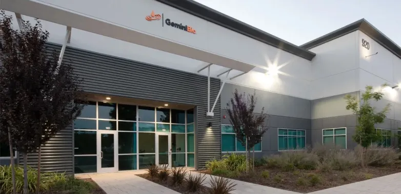 Exterior of GeminiBio’s main facility, a modern building with clean architectural lines and large windows, representing the company’s state-of-the-art capabilities in bioprocessing and manufacturing.